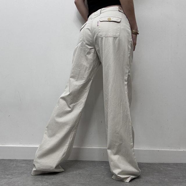 Flared beige wide leg printed trousers