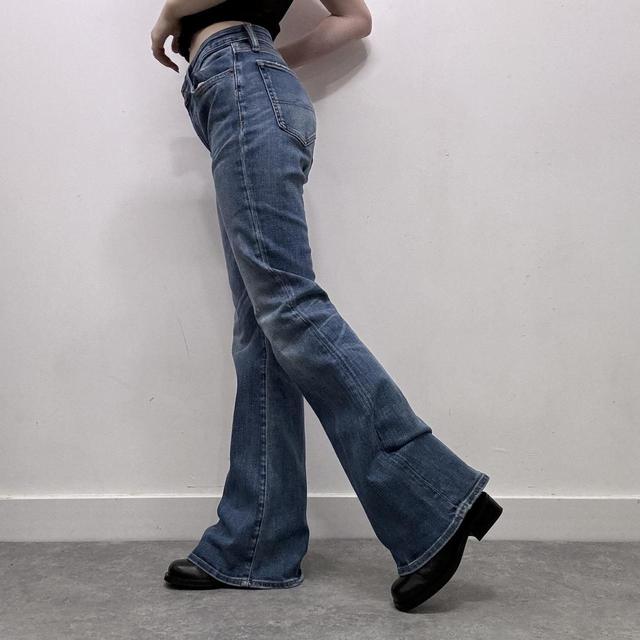 Flared distressed denim jeans