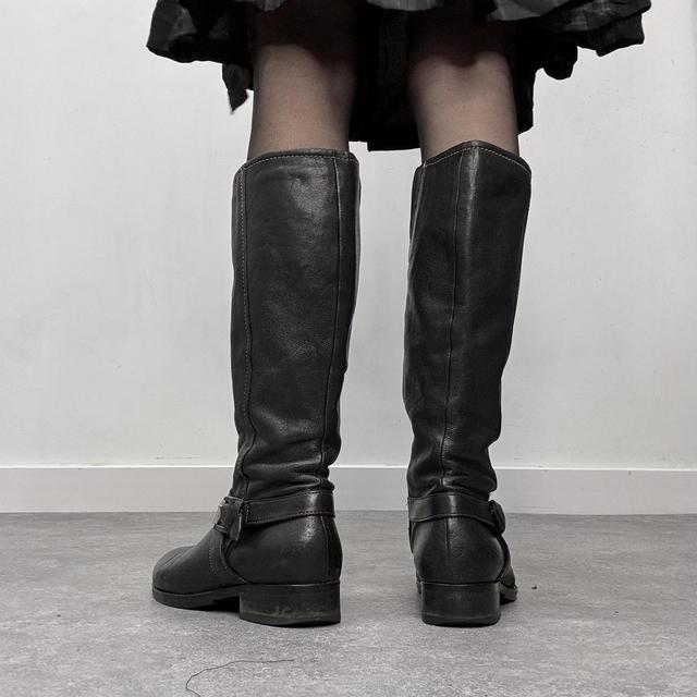 Black buckle riding boots