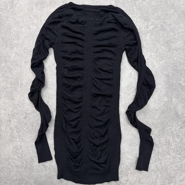 Black cinched long sleeve knit dress