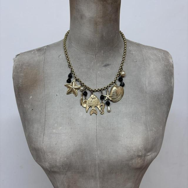 Gold sea shell mermaid charm necklace