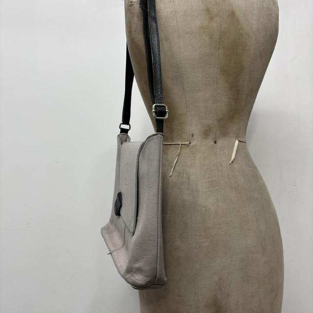 Asymmetrical leather cross-body bag