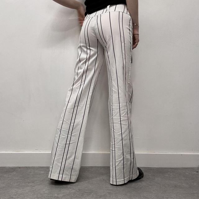 White pinstripe flared suit pants
