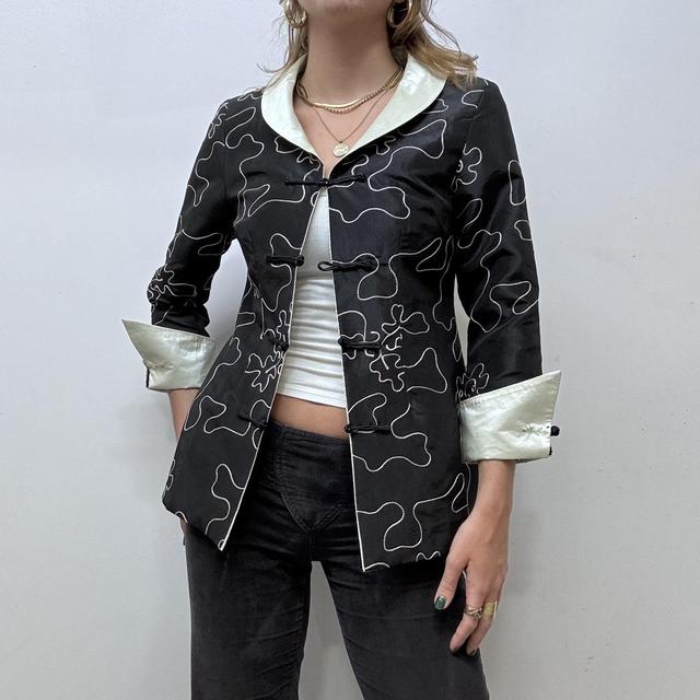 Flared emboidered silk jacket