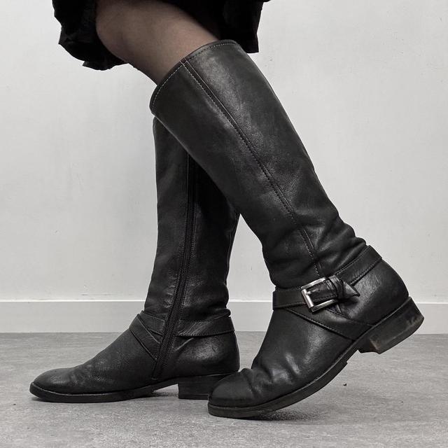 Black buckle riding boots