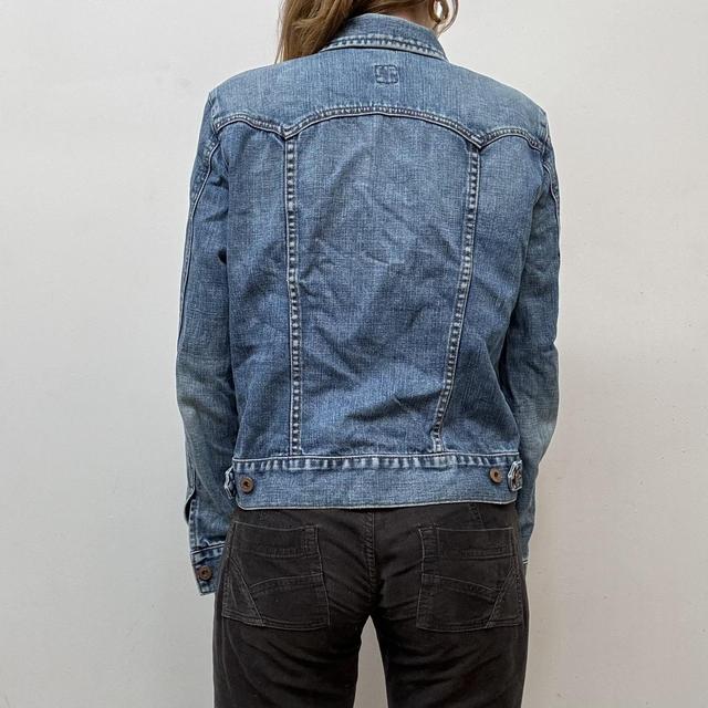 Distressed denim jacket