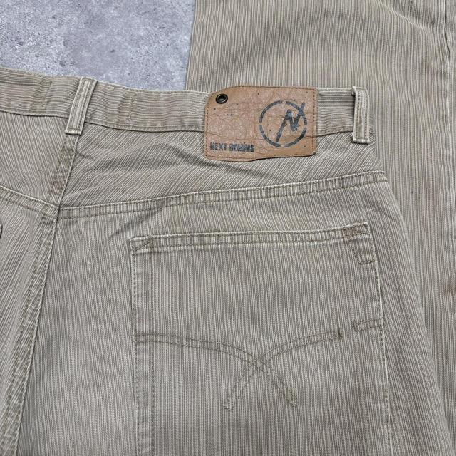 Distressed wash beige jeans