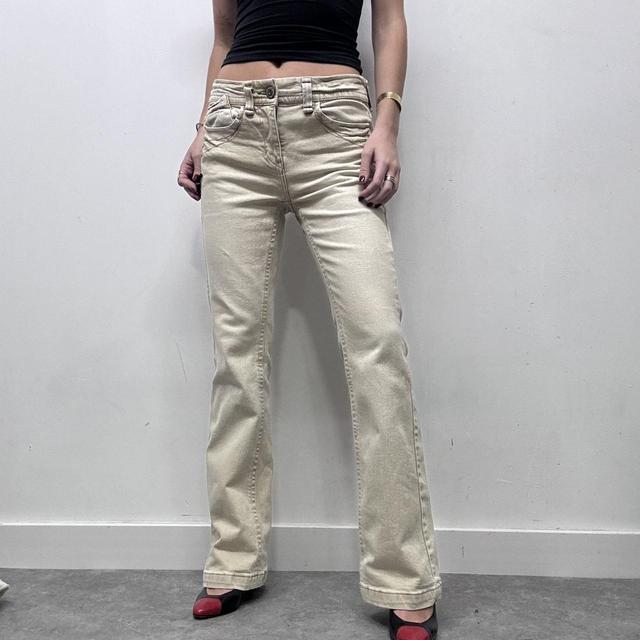 Cream flared distressed trousers