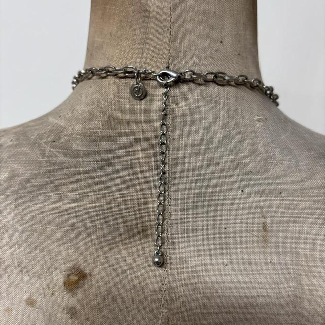 Silver drape charm necklace