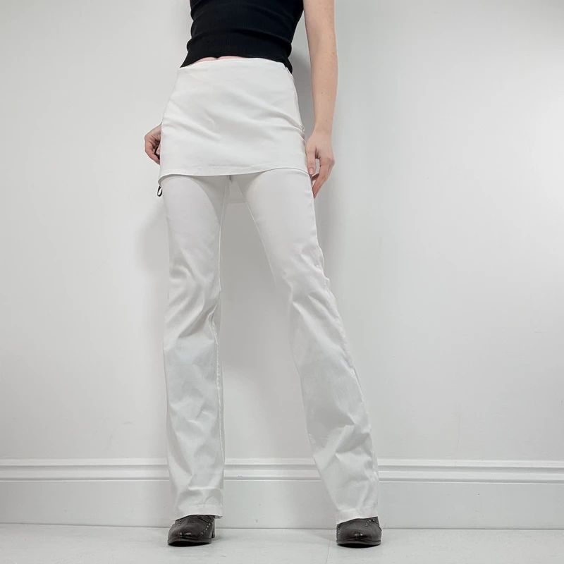 Layered flared trousers with mini skirt overlay