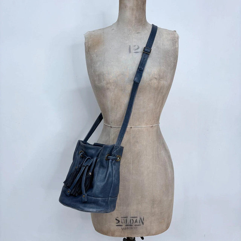 navy blue tassle bucket bag