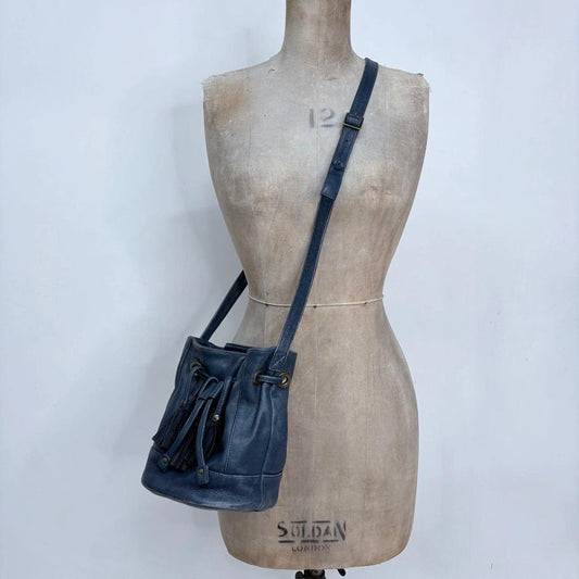 navy blue tassle bucket bag