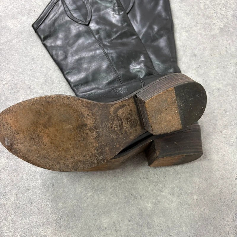 Black leather pointed toe boots