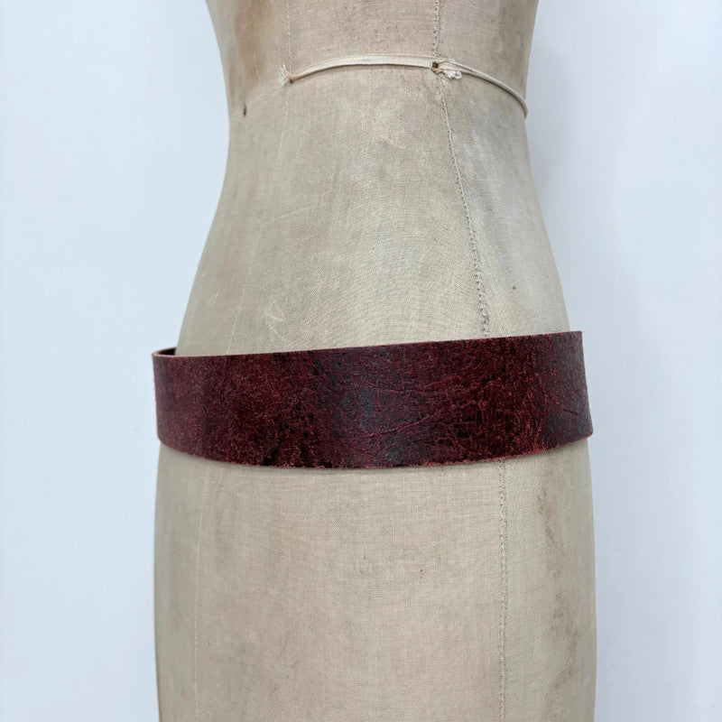 Distressed burgundy red leather belt