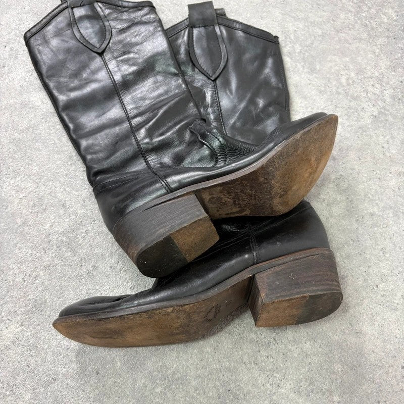 Black leather pointed toe boots