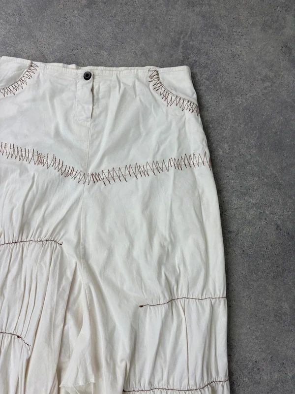 pleated white asymmetric flared maxi skirt