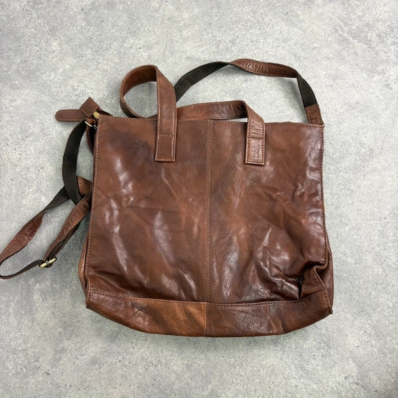 Distressed vintage brown leather handbag