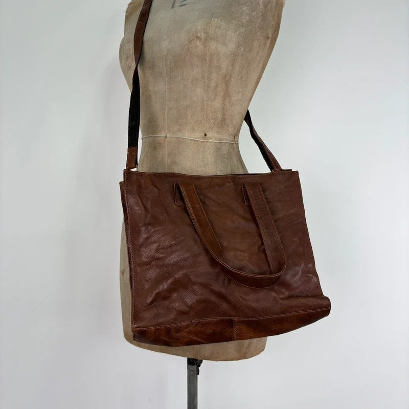 Distressed vintage brown leather handbag