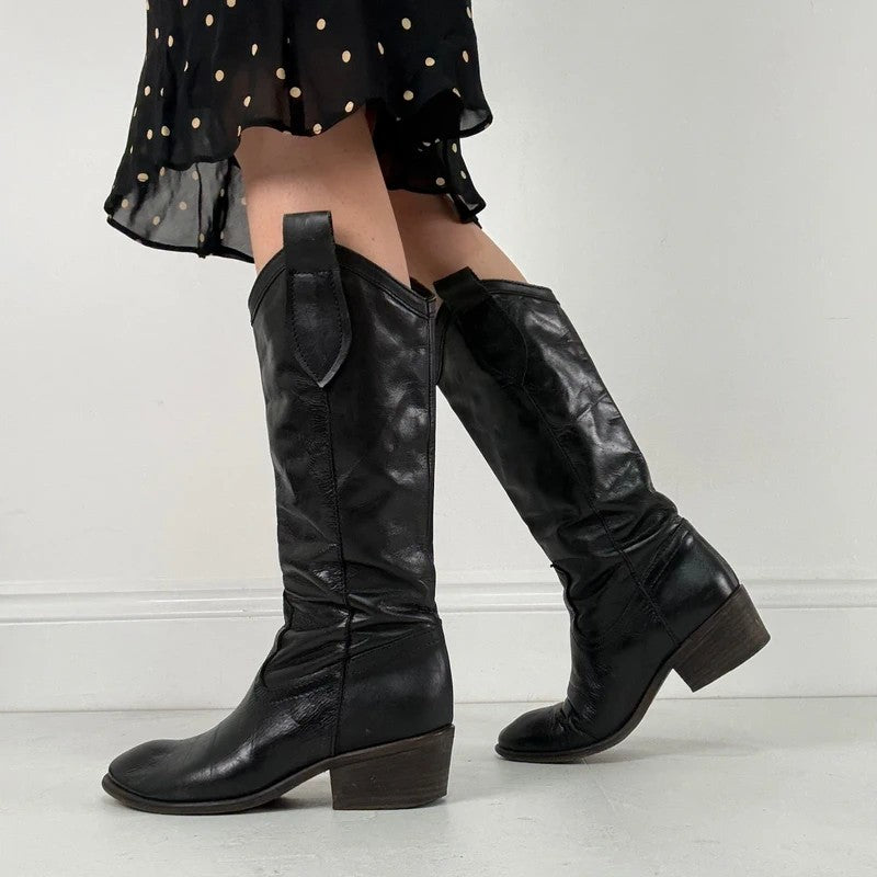 Black leather pointed toe boots