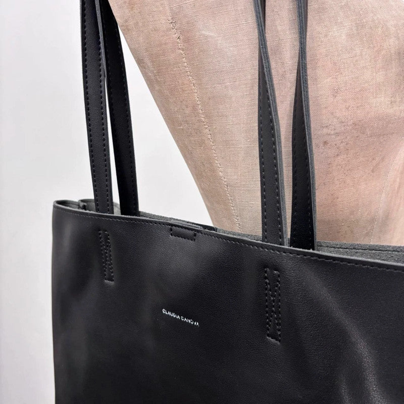 black faux leather tote bag