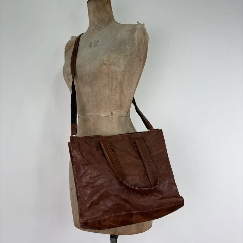 Distressed vintage brown leather handbag