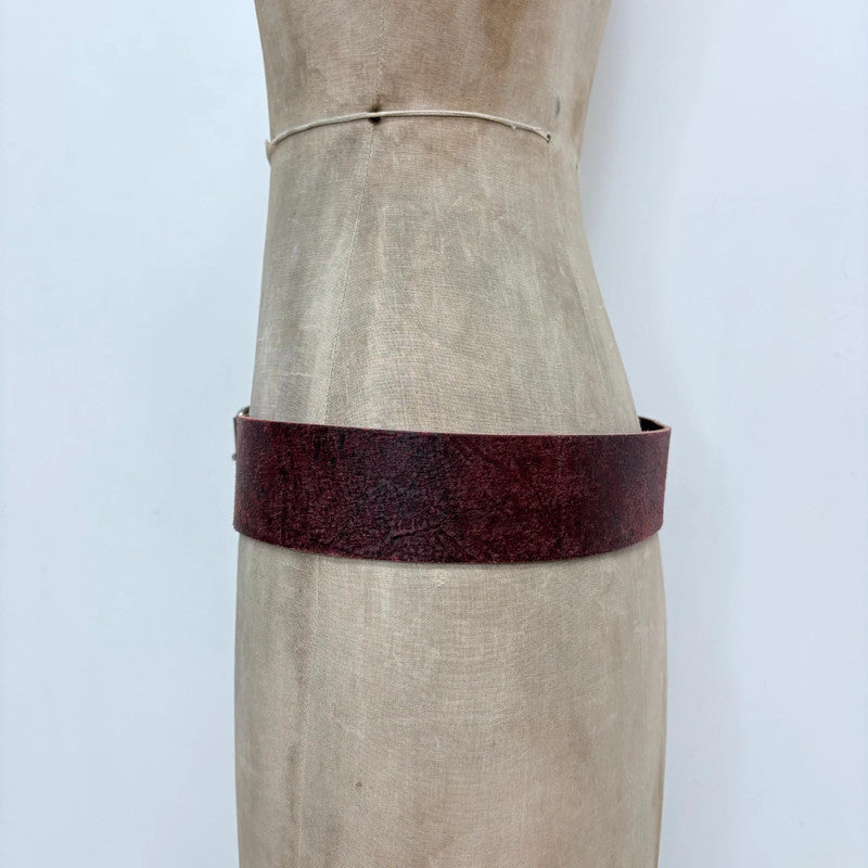Distressed burgundy red leather belt