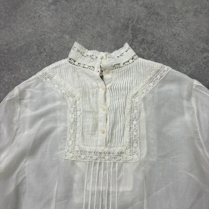 white pleated lace blouse