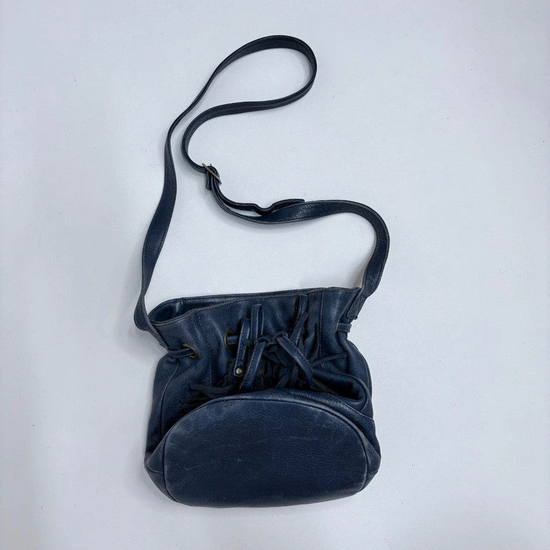 navy blue tassle bucket bag