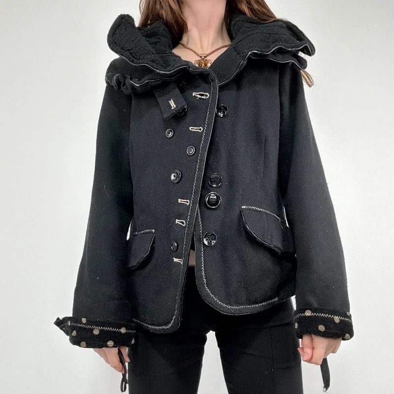black structured asymmetric polkadot coat