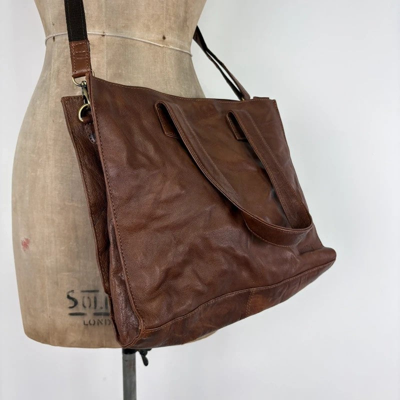 Distressed vintage brown leather handbag