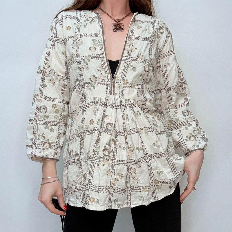 white embroidered flared puff sleeve shirt