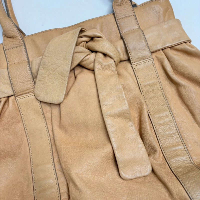tan leather slouchy bow shoulder bag