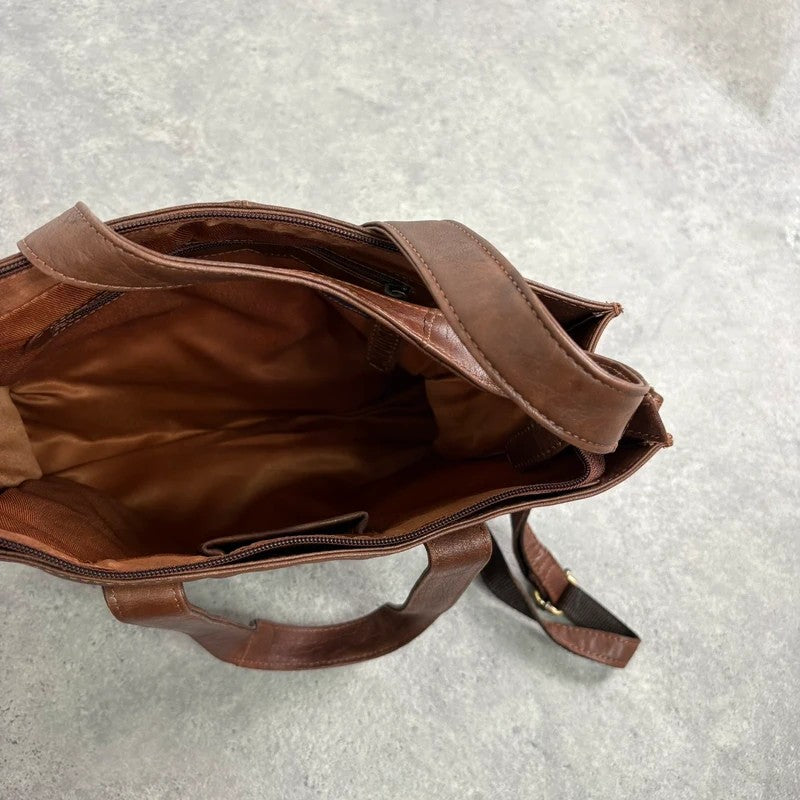Distressed vintage brown leather handbag