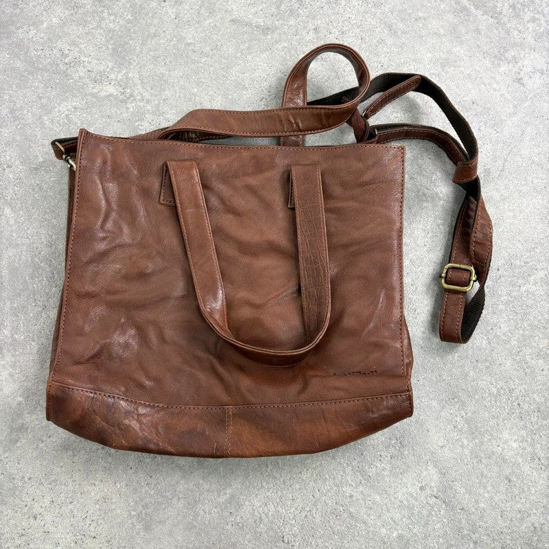 Distressed vintage brown leather handbag