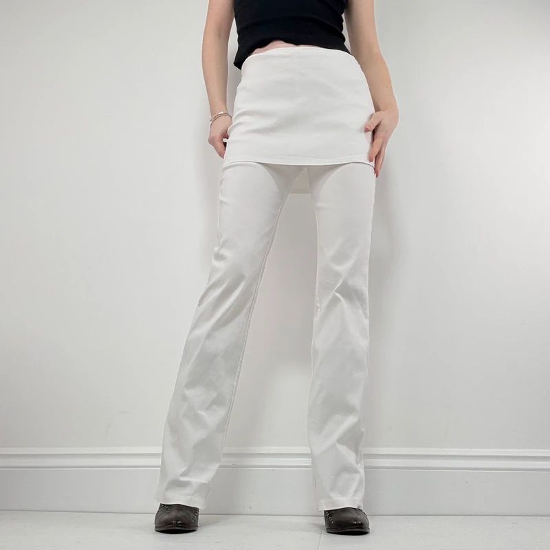 Layered flared trousers with mini skirt overlay