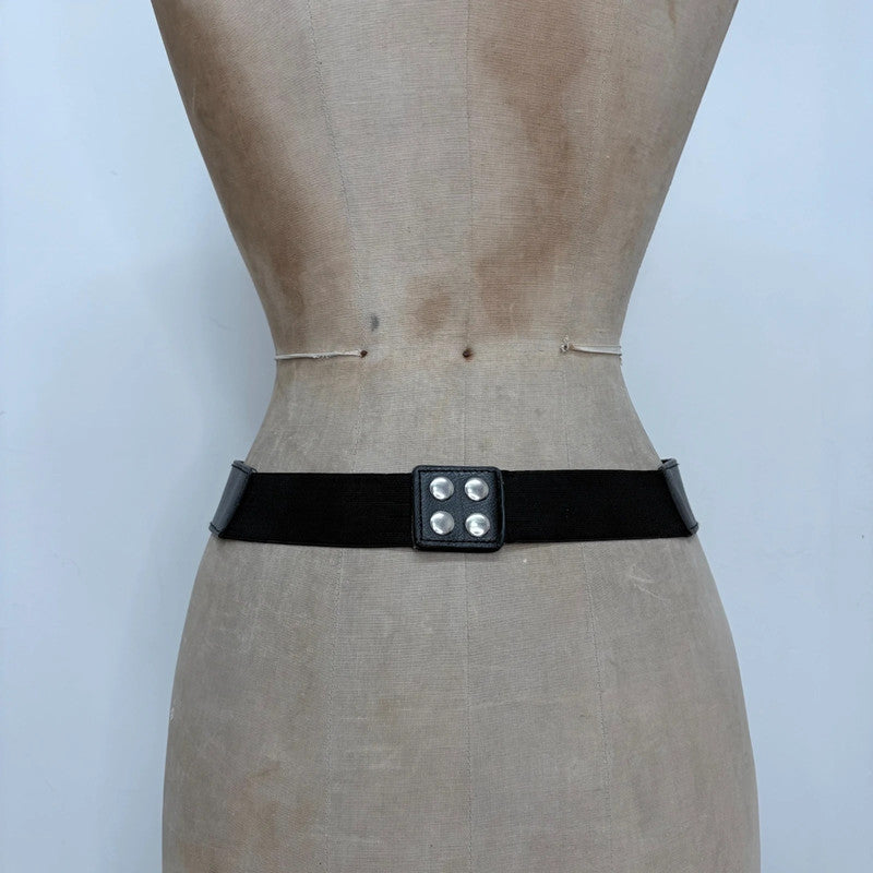 black faux leather silver spellout belt