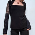 black wide neck flared top sweater