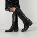 Black leather pointed toe boots