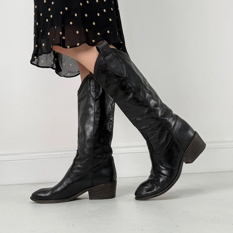 Black leather pointed toe boots