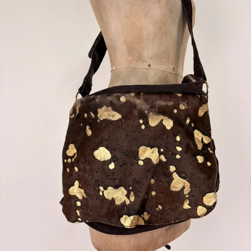 Brown cow hide leather satchel bag with gold embellishment