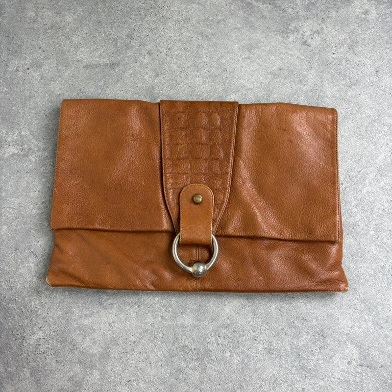 tan lather piercing punky silver hardware clutch bag