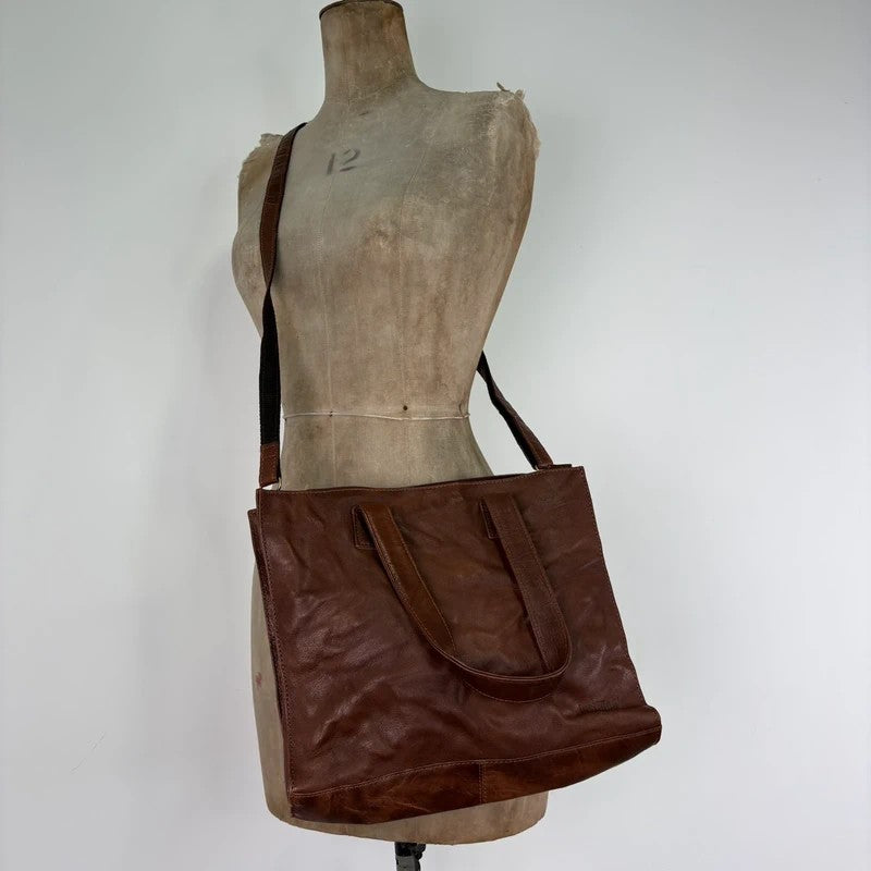 Distressed vintage brown leather handbag