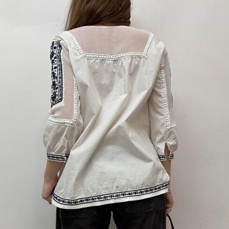 white crochet shirt with navy embroidery