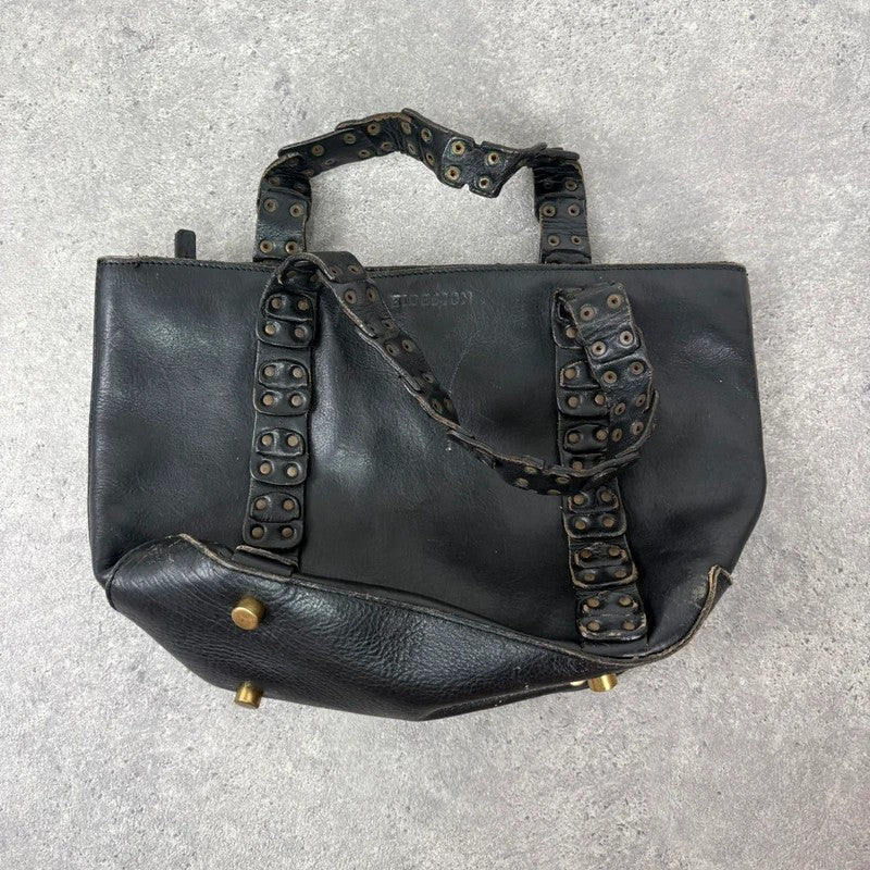 Black mini handbag with studded patchwork handle.