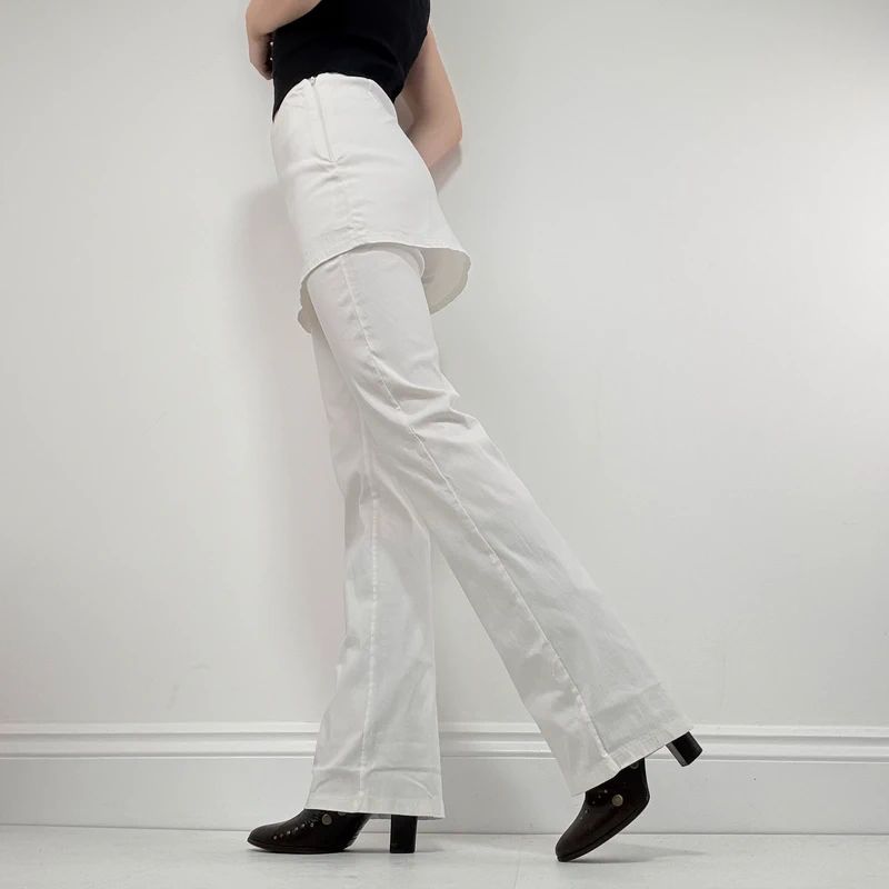 Layered flared trousers with mini skirt overlay