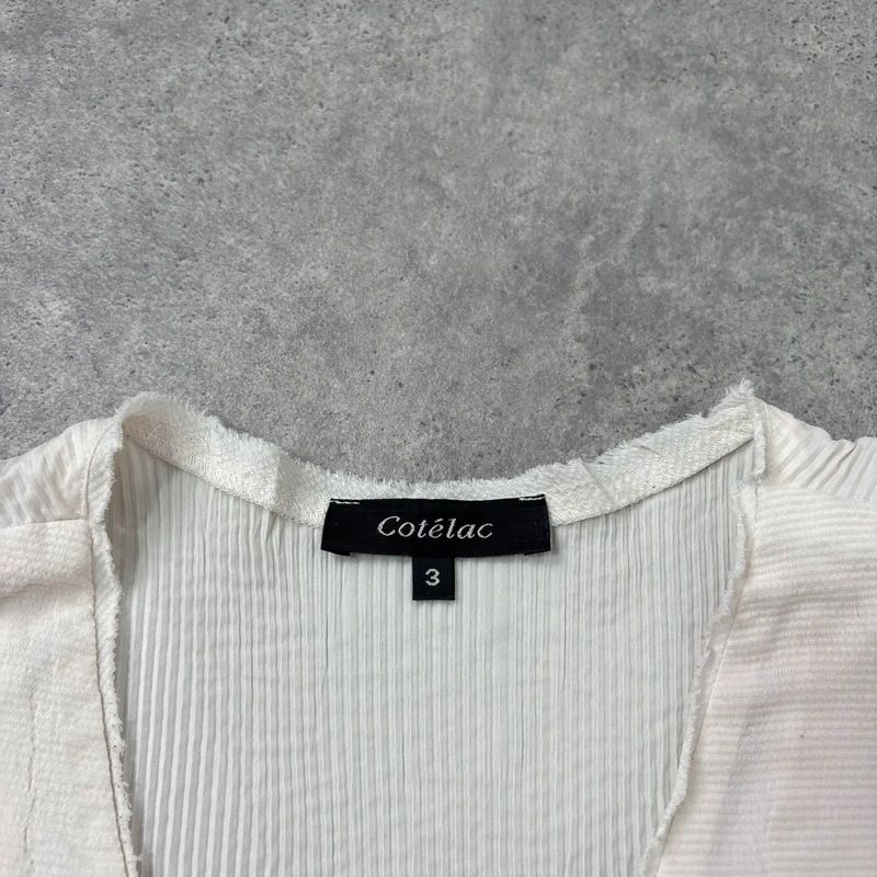 white cotton pleated blouse