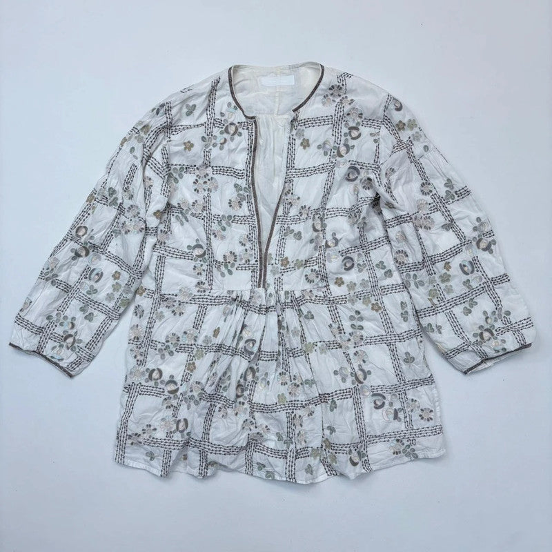 white embroidered flared puff sleeve shirt