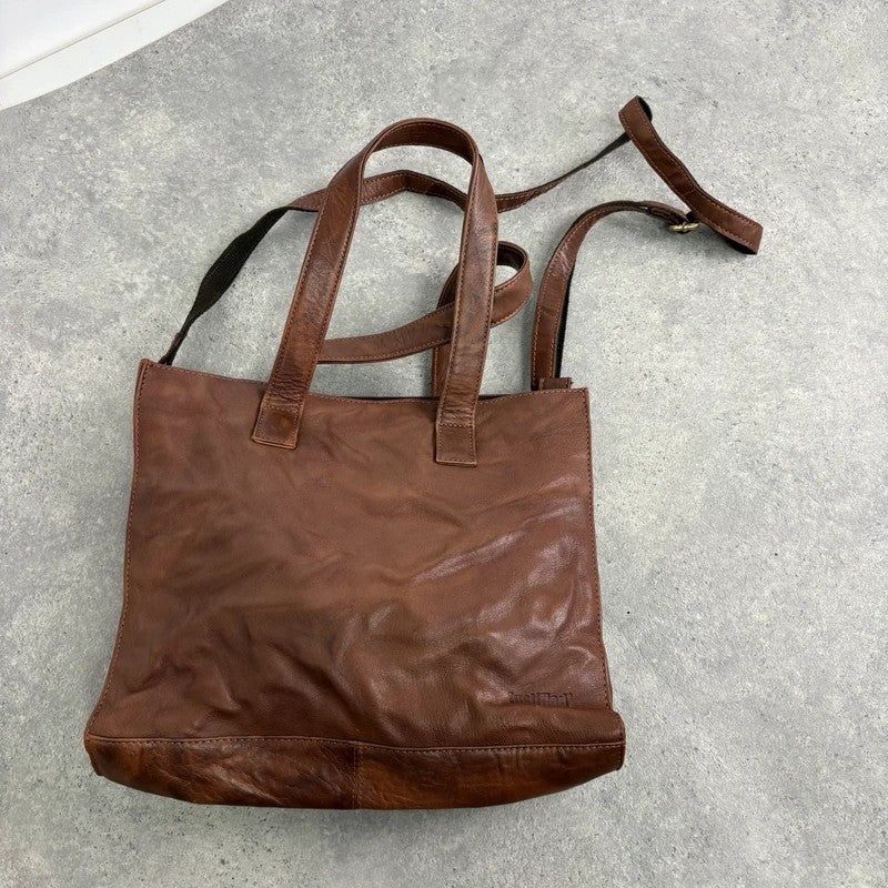 Distressed vintage brown leather handbag
