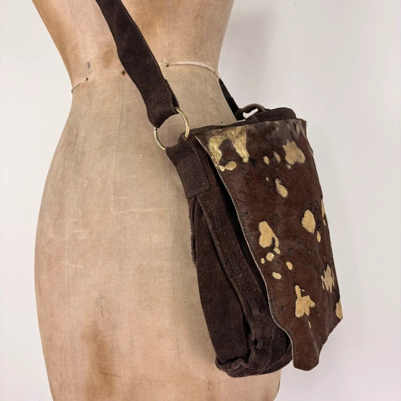 Brown cow hide leather satchel bag with gold embellishment