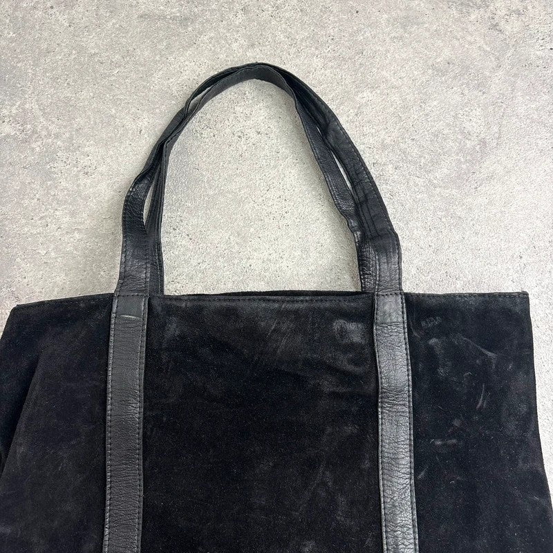 Black suede tote bag with gold studded spikes